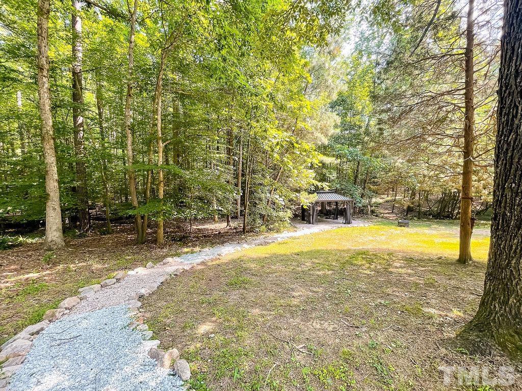 6700 Laurdane Road Raleigh, NC 27613 - Photo 24 of 25 a view of a swimming pool with an outdoor space