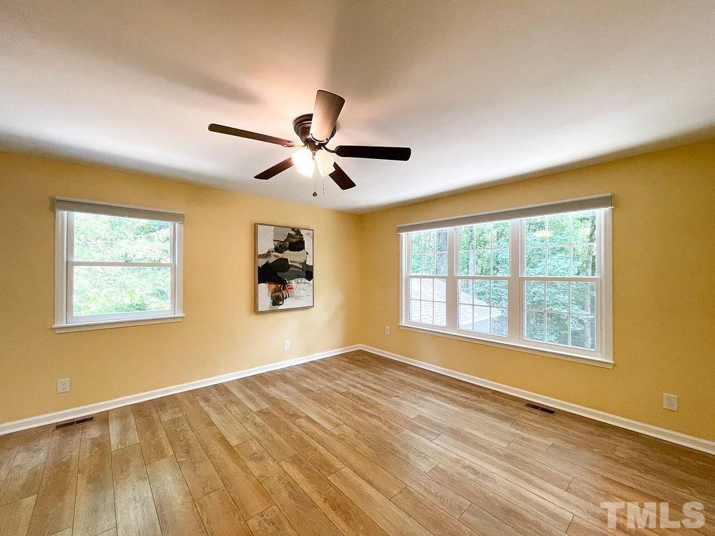 6700 Laurdane Road Raleigh, NC 27613 - Photo 8 of 25 a view of an empty room with a window
