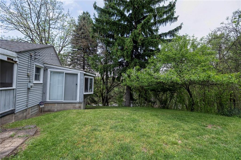 531 Laughlin Avenue Pittsburgh, PA 15210 - Photo 25 of 35 a view of a backyard with a large tree