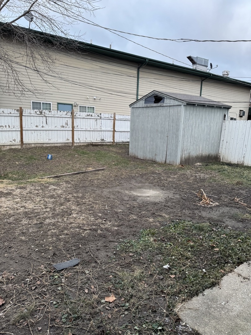 106 Valley View Drive, Unit 106 McHenry, IL 60050 - Photo 2 of 7 a view of backyard and garage