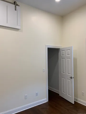 an empty room with wooden floor