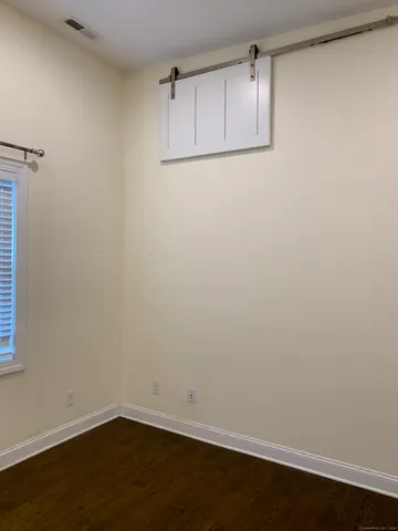 a view of a small space with wooden floor