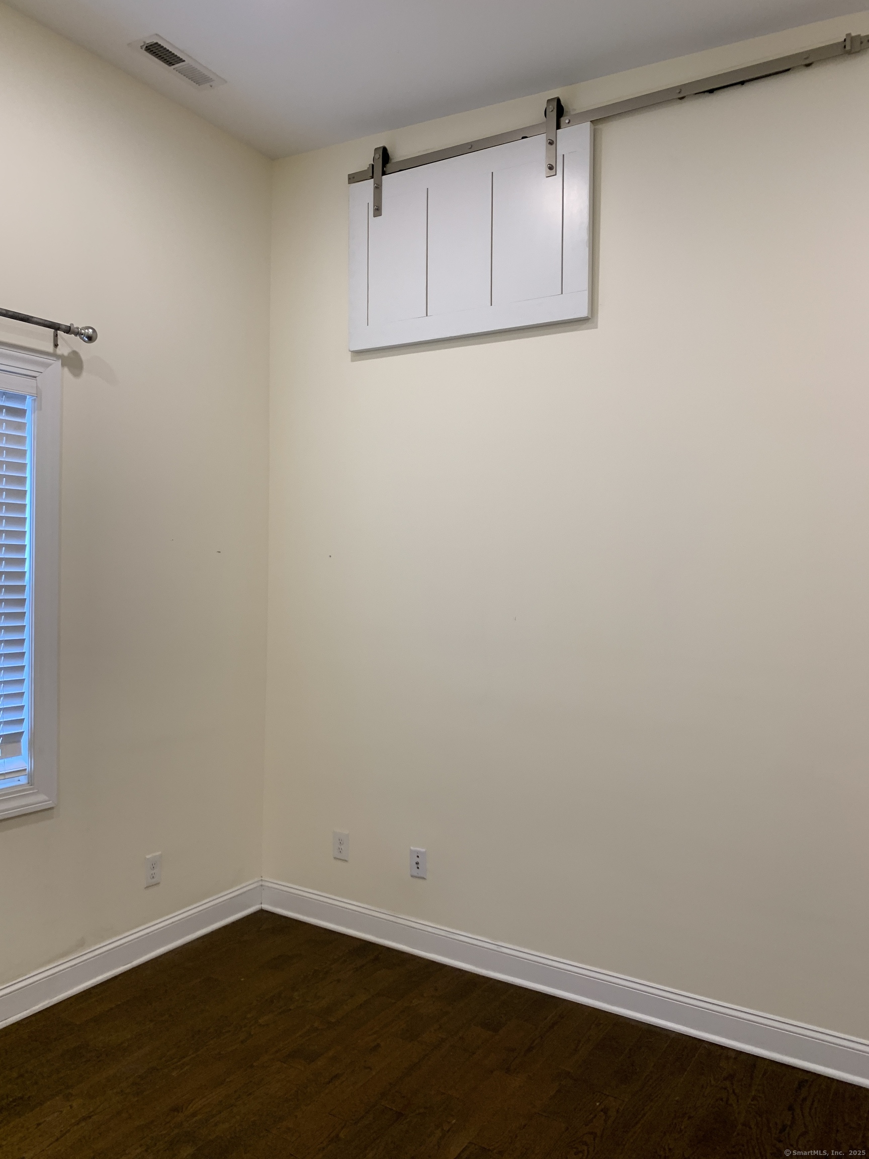 66 Cedar Street, Unit 2 Norwalk, CT 06854 - Photo 10 of 23 a view of a small space with wooden floor