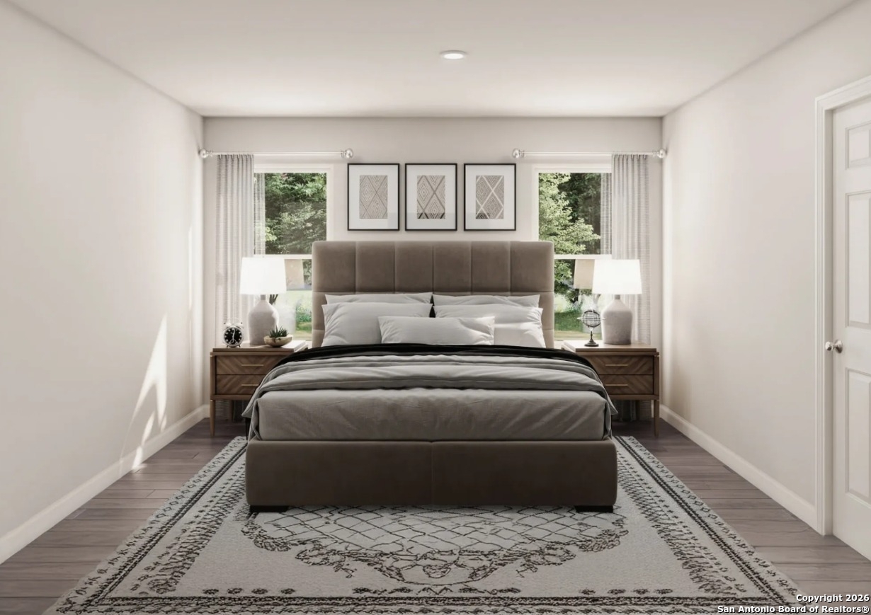 102 Sutton Place Uvalde, TX 78801 - Photo 3 of 5 a bed sitting in a bedroom next to a window