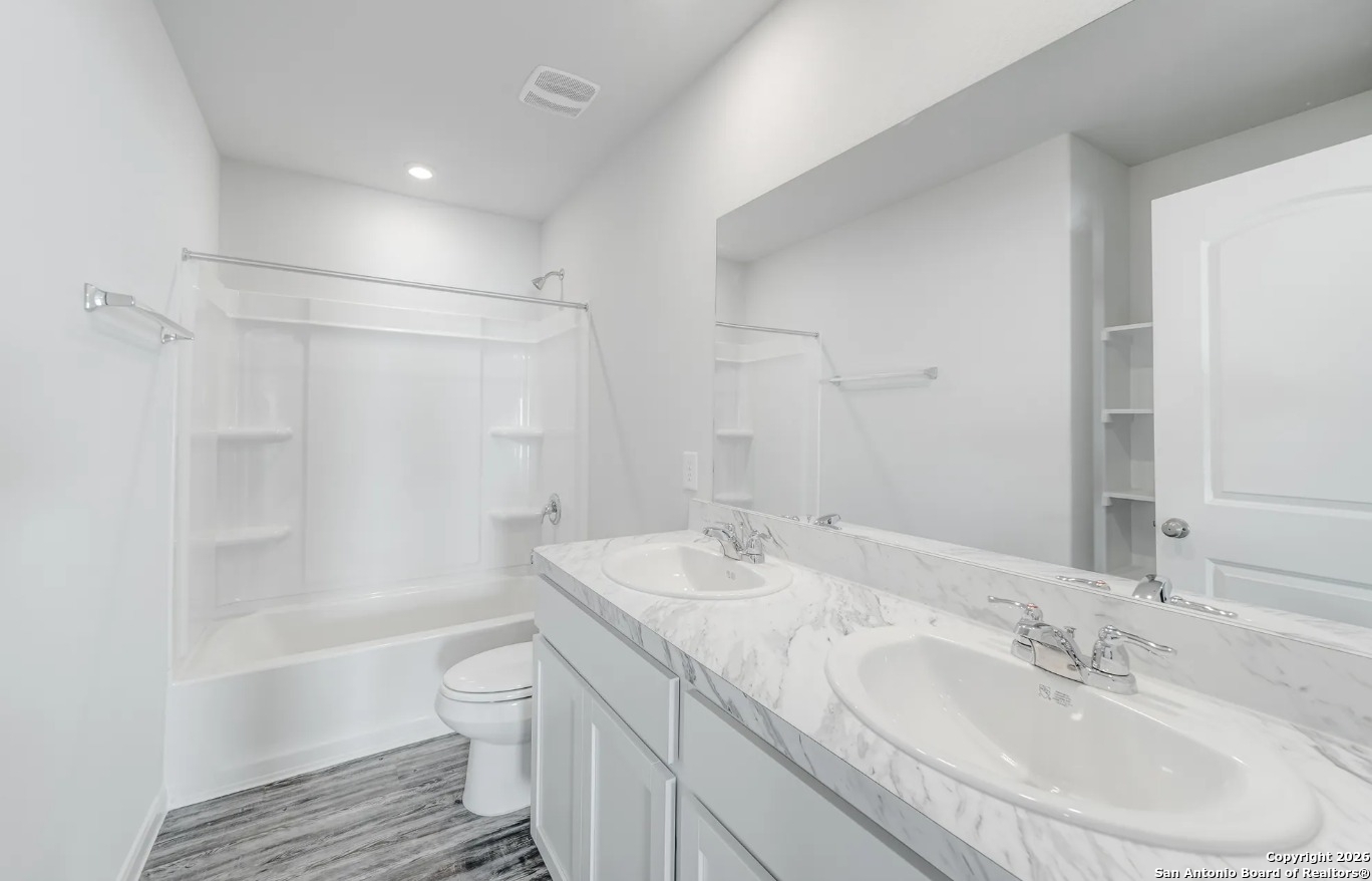 102 Sutton Place Uvalde, TX 78801 - Photo 5 of 5 a bathroom with a sink toilet and shower
