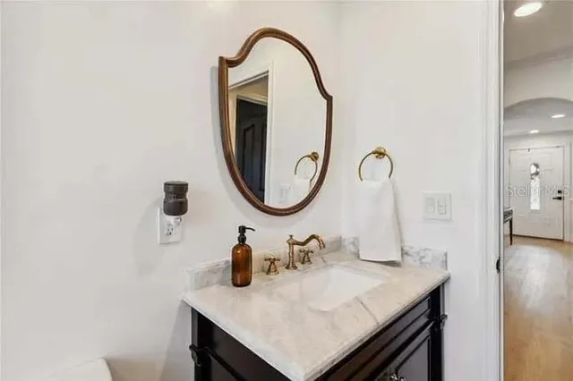 a bathroom with a sink and a mirror
