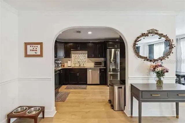 a kitchen with stainless steel appliances a refrigerator and stove