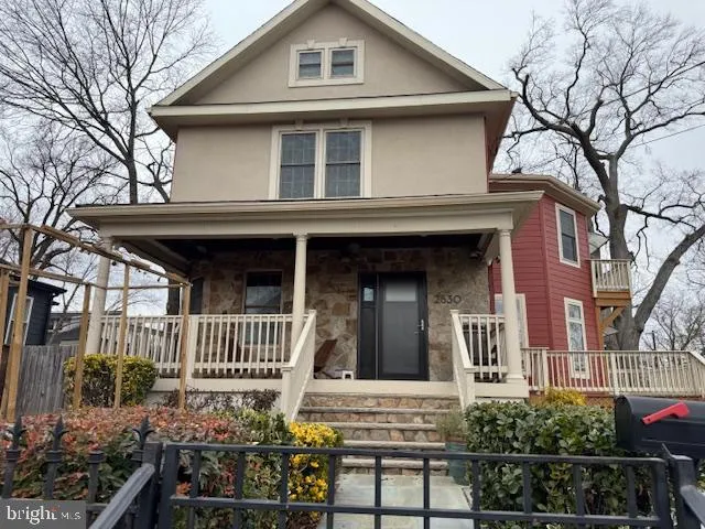 a front view of a house with stairs