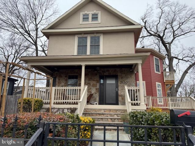 a front view of a house with stairs