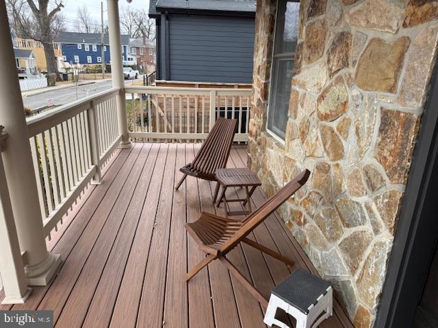 2630 Brentwood Road Northeast Washington, DC 20018 - Photo 5 of 10 a view of balcony with wooden floor and bench