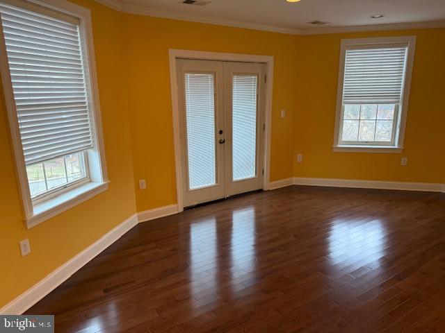2630 Brentwood Road Northeast Washington, DC 20018 - Photo 10 of 10 a view of an empty room with wooden floor and a window