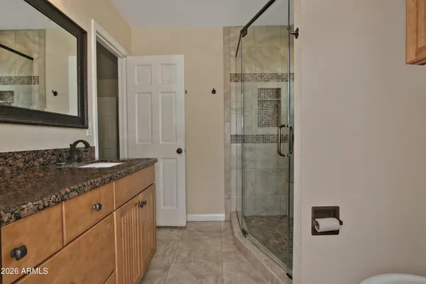 a bathroom with a shower and a shower