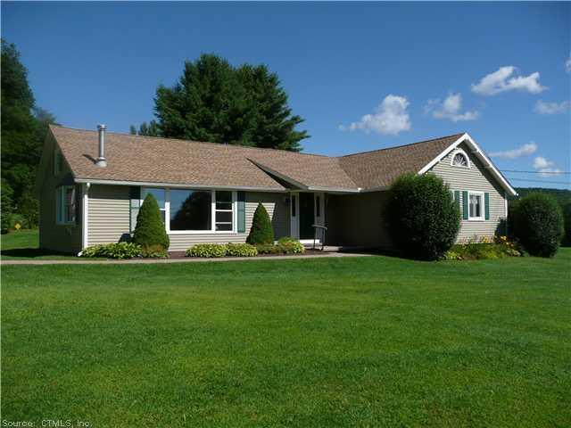 16 Sandy Brook Road Colebrook, CT 06021 - Photo 1 of 1 a front view of a house with a garden and porch