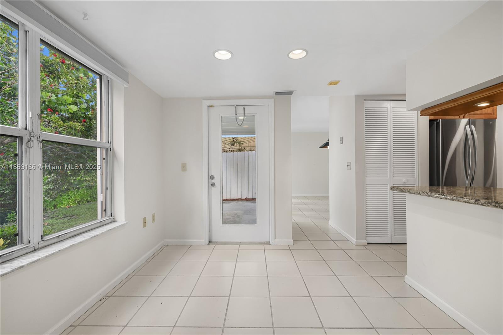 7150 Southwest 55th Terrace West Miami, FL 33155 - Photo 11 of 24 a view of a kitchen with a closet and windows