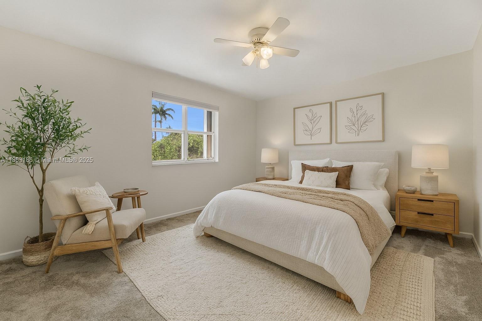 7150 Southwest 55th Terrace West Miami, FL 33155 - Photo 12 of 24 a bedroom with a bed and a chandelier