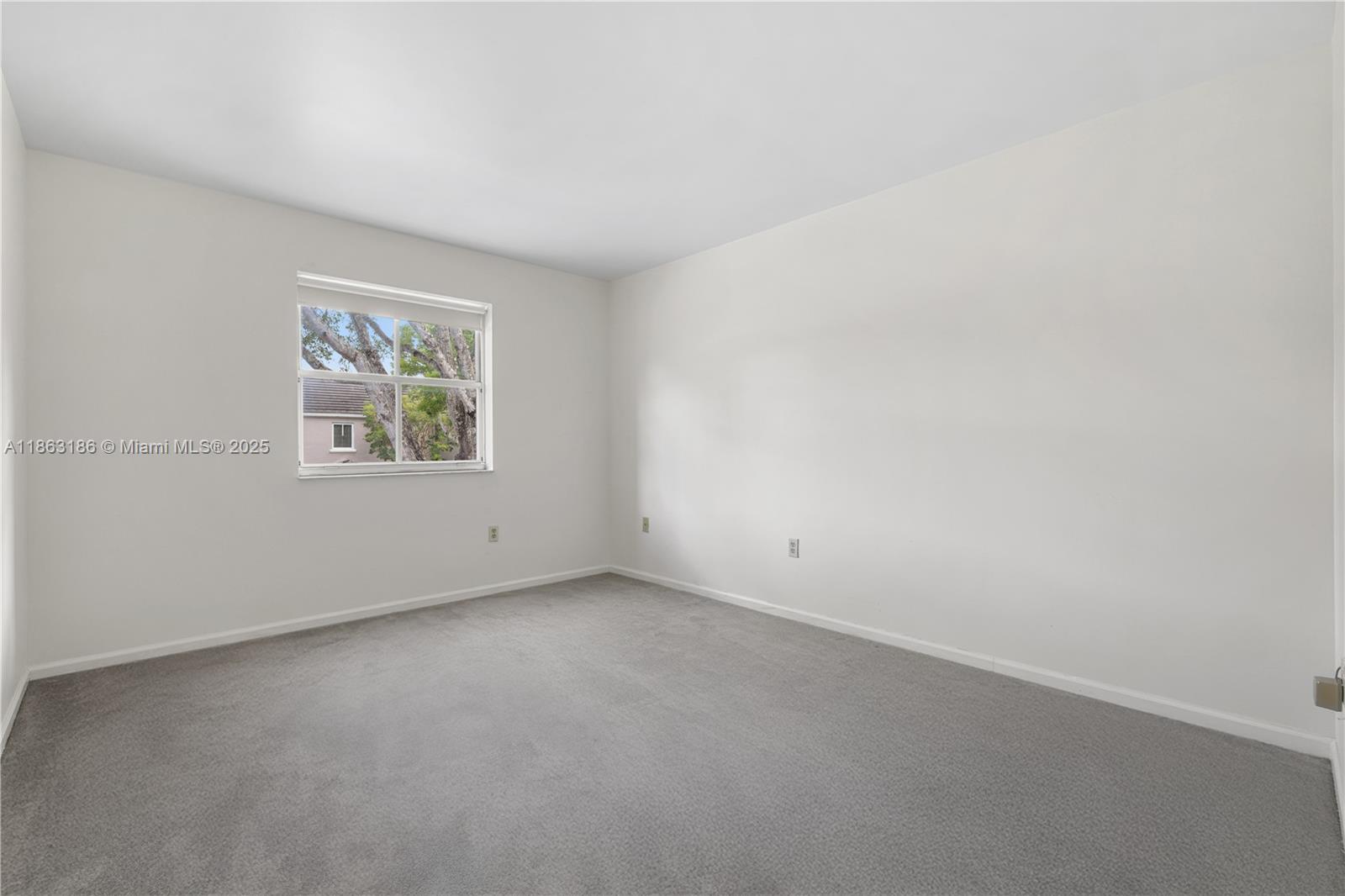7150 Southwest 55th Terrace West Miami, FL 33155 - Photo 16 of 24 an empty room with a window