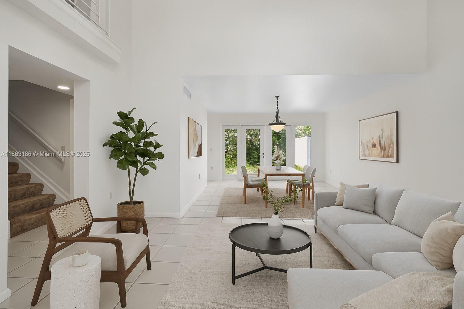 7150 Southwest 55th Terrace West Miami, FL 33155 - Photo 4 of 24 a living room with furniture potted plant and a window