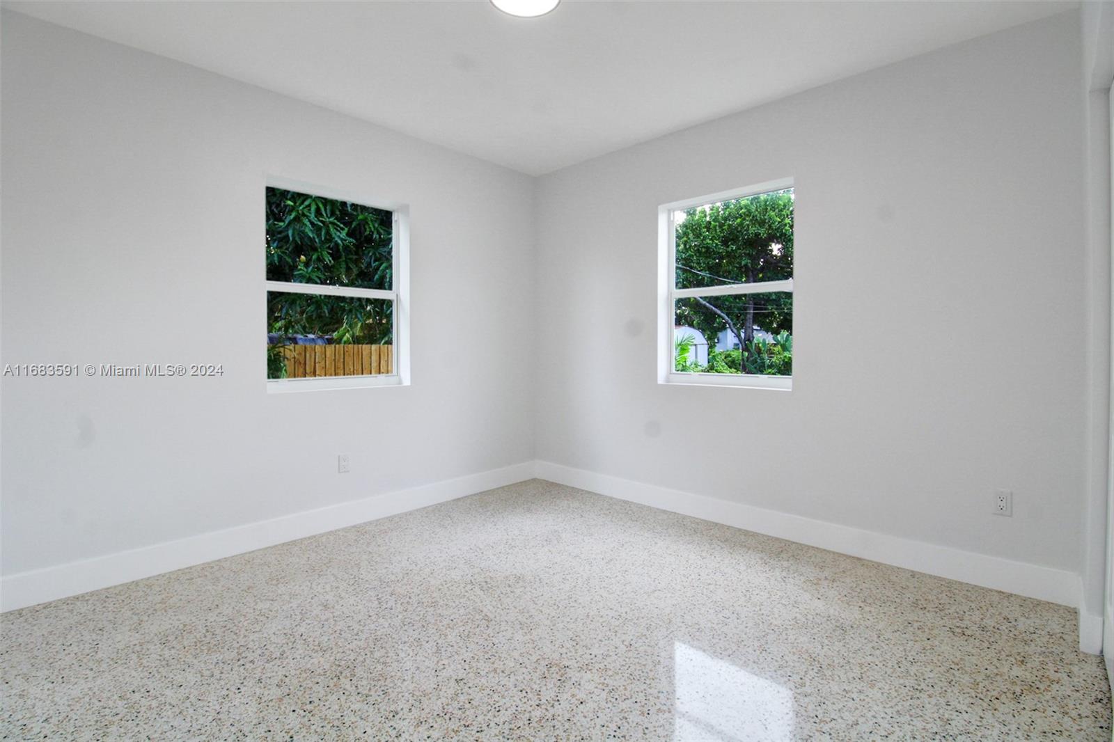 7120 Southwest 9th Street Miami, FL 33144 - Photo 16 of 25 an empty room with a window