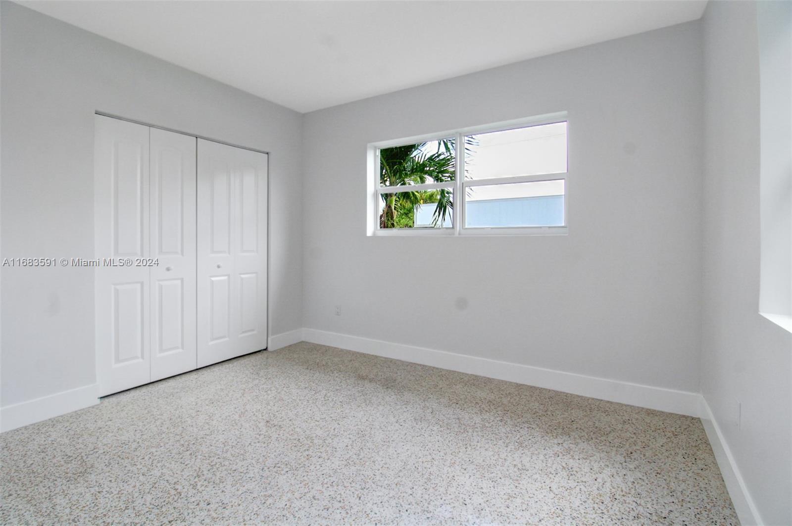 7120 Southwest 9th Street Miami, FL 33144 - Photo 18 of 25 an empty room with windows
