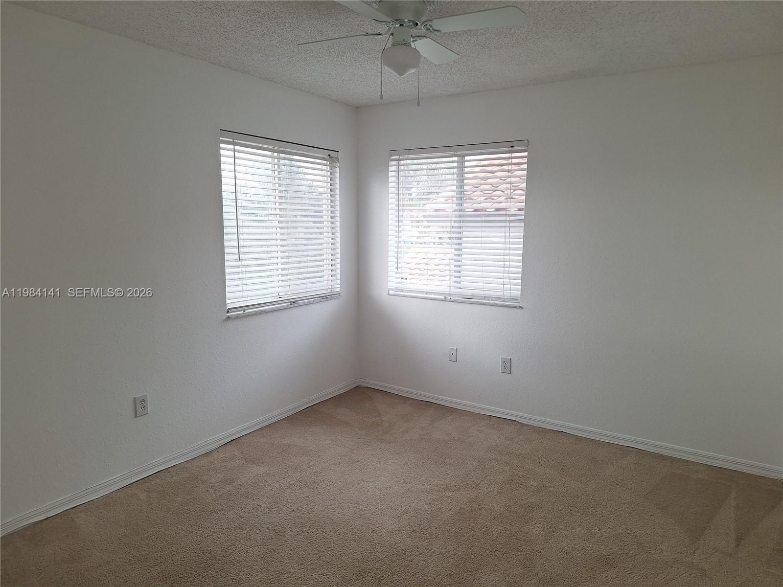 446 Lakeside Circle Sunrise, FL 33326 - Photo 12 of 13 an empty room with a window