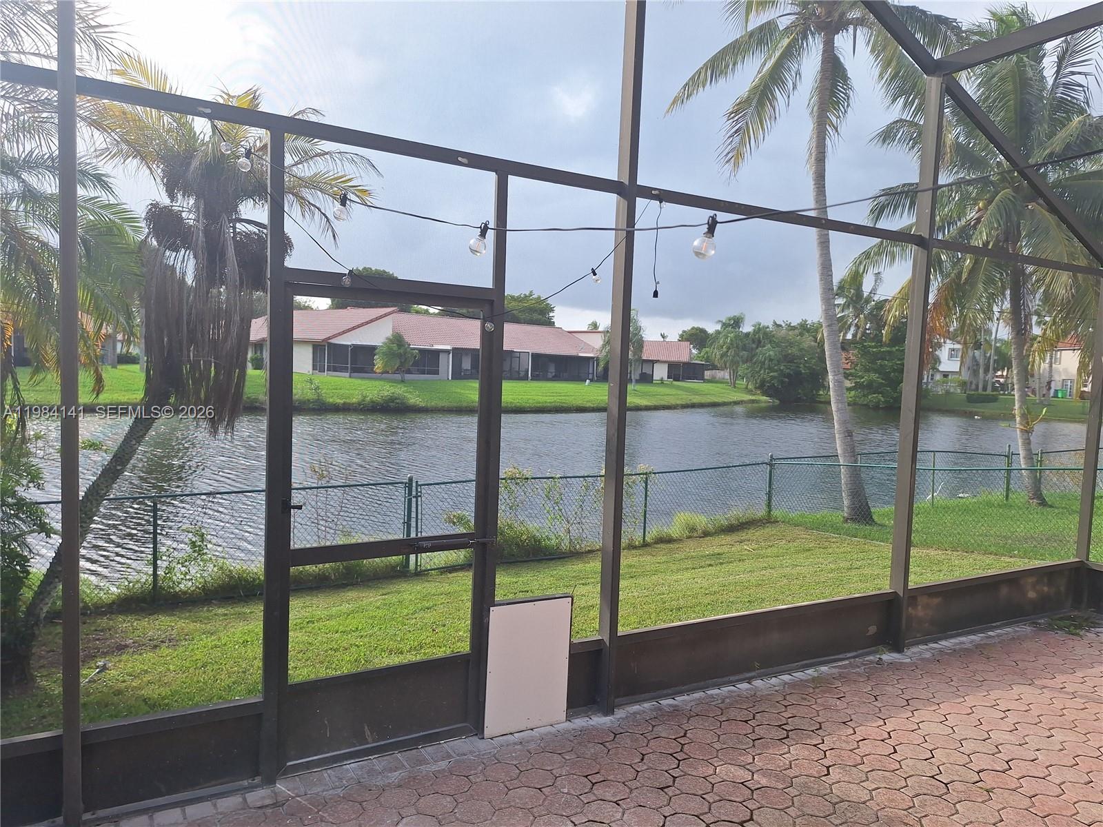 446 Lakeside Circle Sunrise, FL 33326 - Photo 13 of 13 a view of a park with a small yard