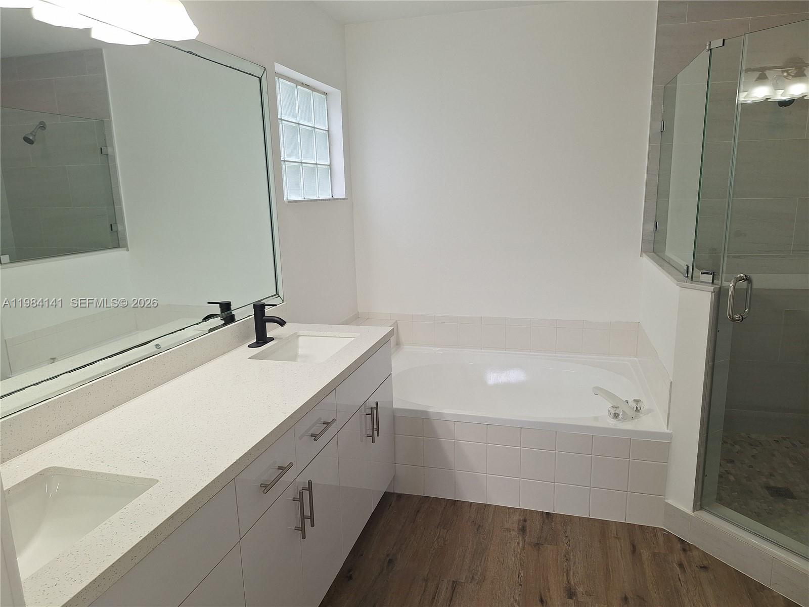 446 Lakeside Circle Sunrise, FL 33326 - Photo 9 of 13 a bathroom with a sink and a bathtub