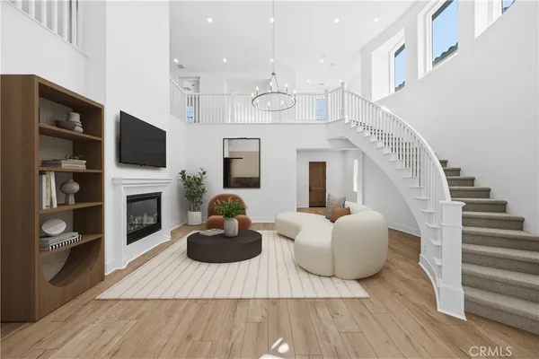 a living room with furniture fireplace and flat screen tv