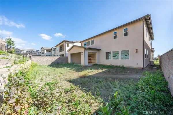 a front view of a house with yard