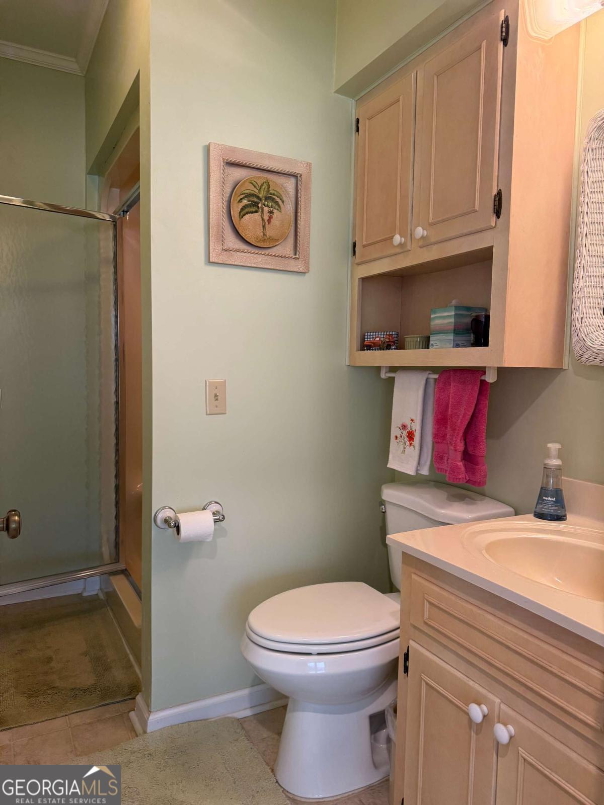 5686 Golden Isle West Baxley, GA 31513 - Photo 34 of 122 a bathroom with a toilet a sink and vanity