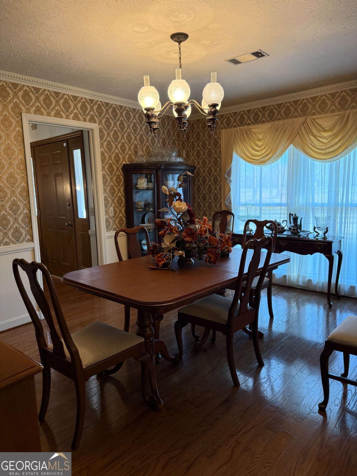 5686 Golden Isle West Baxley, GA 31513 - Photo 50 of 122 a view of a dining room with furniture and wooden floor