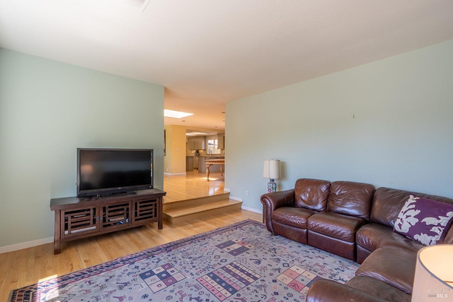 1550 Yountville Cross Road Napa, CA 94558 - Photo 18 of 45 a living room with furniture and a flat screen tv