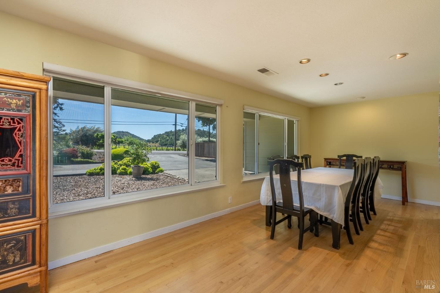 1550 Yountville Cross Road Napa, CA 94558 - Photo 19 of 45 a view of a dining room with furniture window and outside view