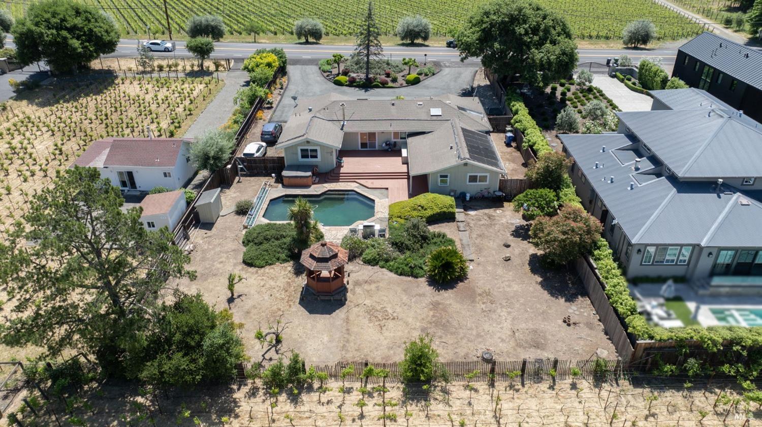 1550 Yountville Cross Road Napa, CA 94558 - Photo 2 of 45 an aerial view of multiple houses with yard