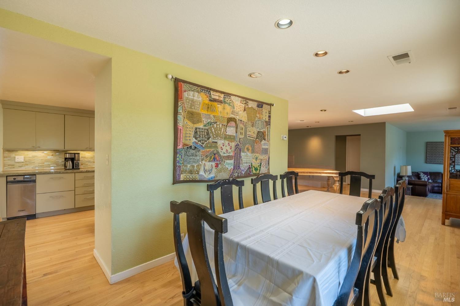 1550 Yountville Cross Road Napa, CA 94558 - Photo 22 of 45 a view of a dining room with furniture and wooden floor