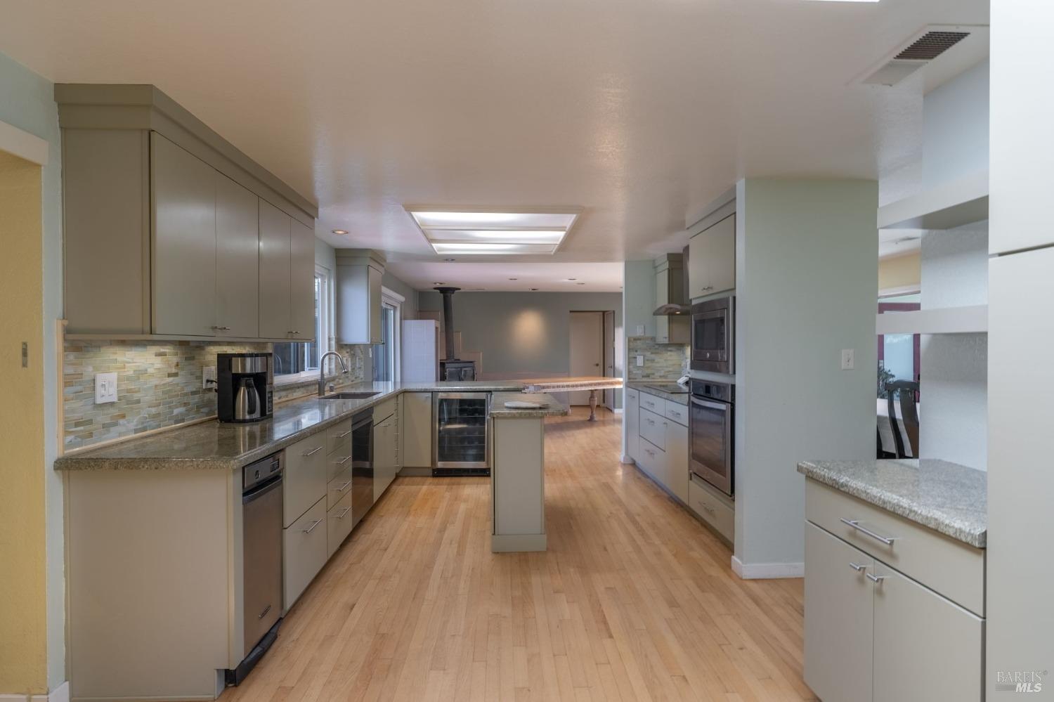1550 Yountville Cross Road Napa, CA 94558 - Photo 24 of 45 a kitchen with cabinets and stainless steel appliances