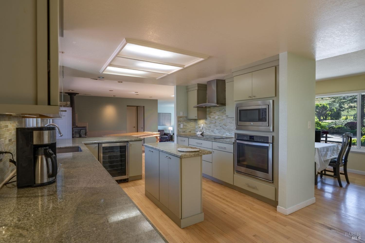1550 Yountville Cross Road Napa, CA 94558 - Photo 25 of 45 a kitchen with cabinets and stainless steel appliances