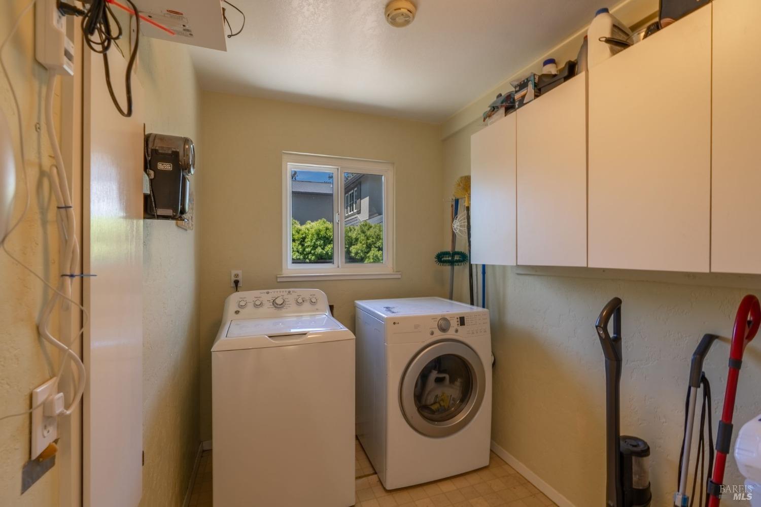1550 Yountville Cross Road Napa, CA 94558 - Photo 27 of 45 a utility room with dryer and washer