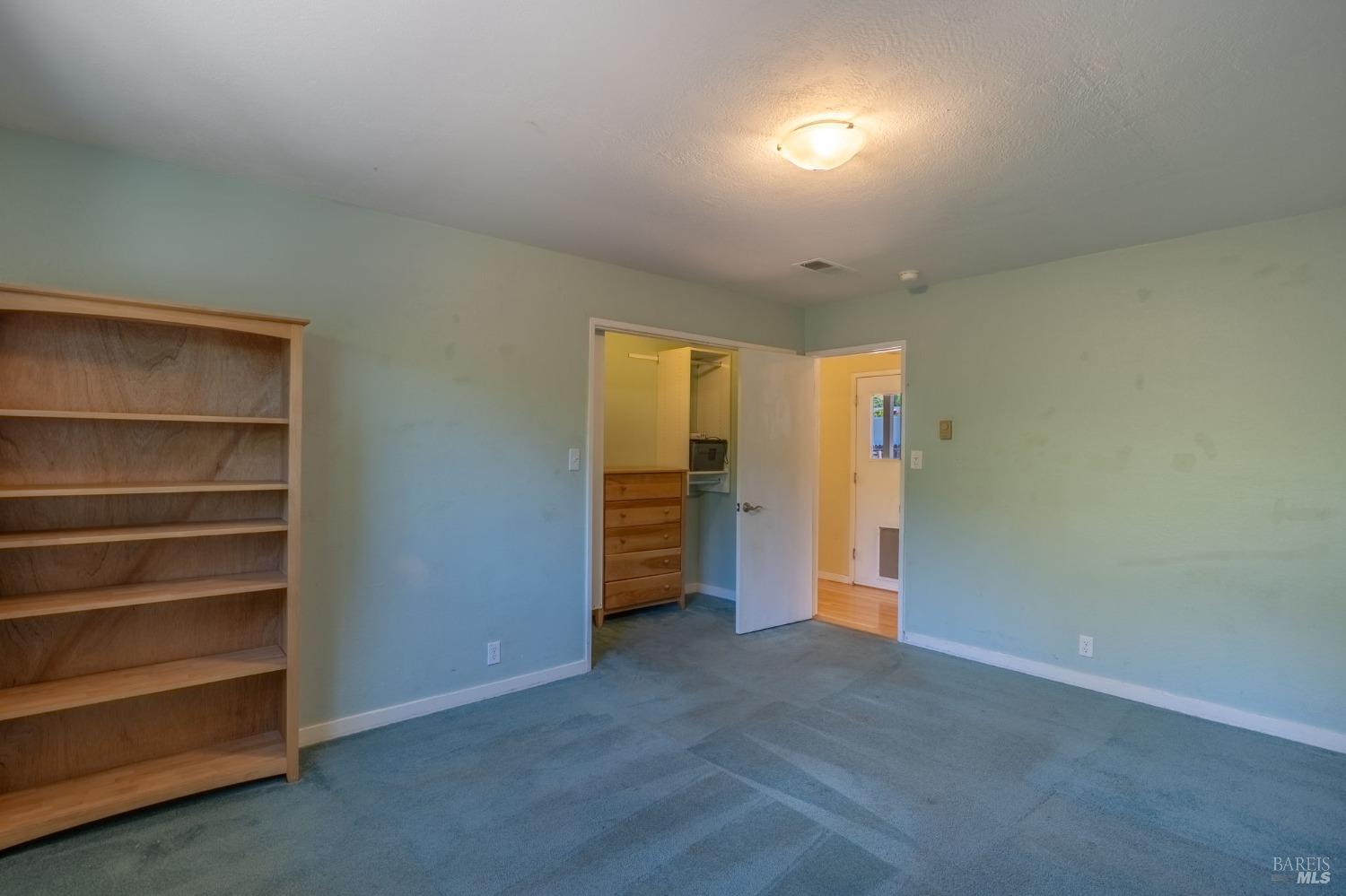 1550 Yountville Cross Road Napa, CA 94558 - Photo 30 of 45 a view of an empty room with closet and a window