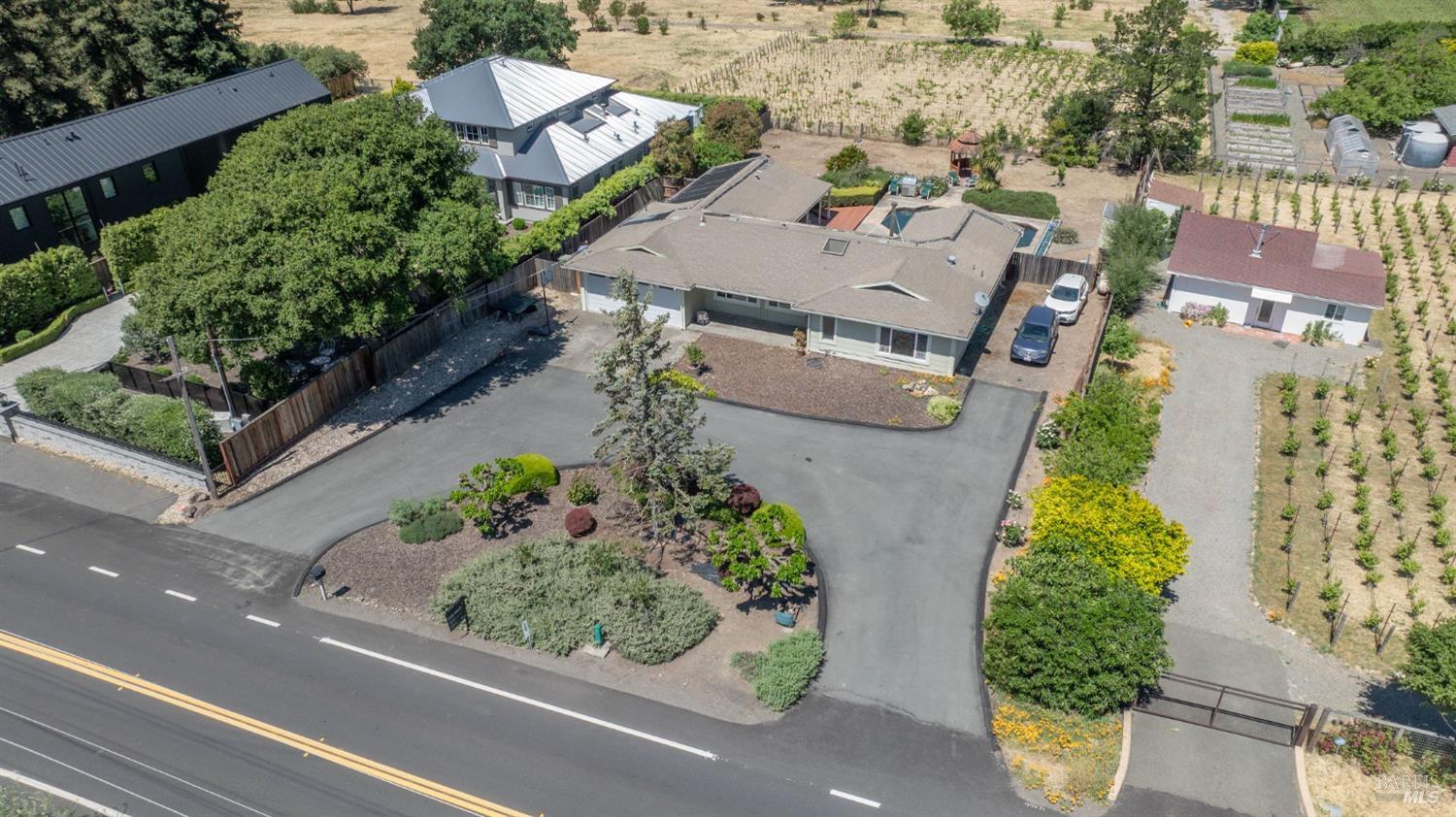 1550 Yountville Cross Road Napa, CA 94558 - Photo 3 of 45 an aerial view of multiple houses with yard