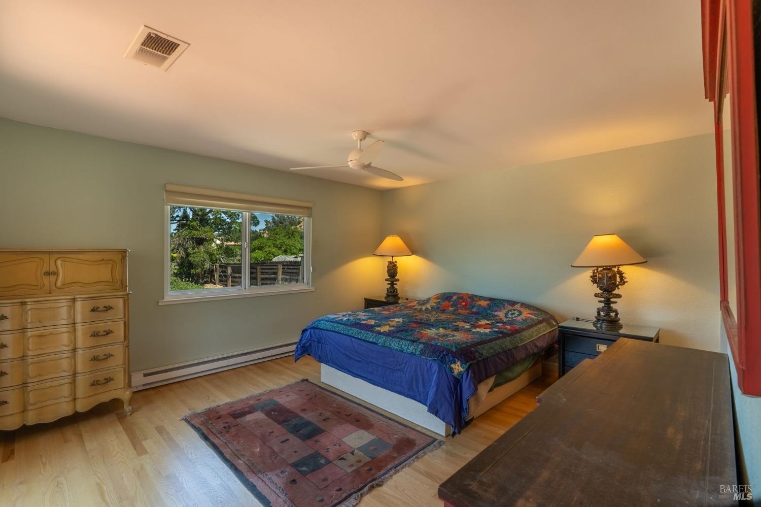 1550 Yountville Cross Road Napa, CA 94558 - Photo 33 of 45 a bedroom with bed and window