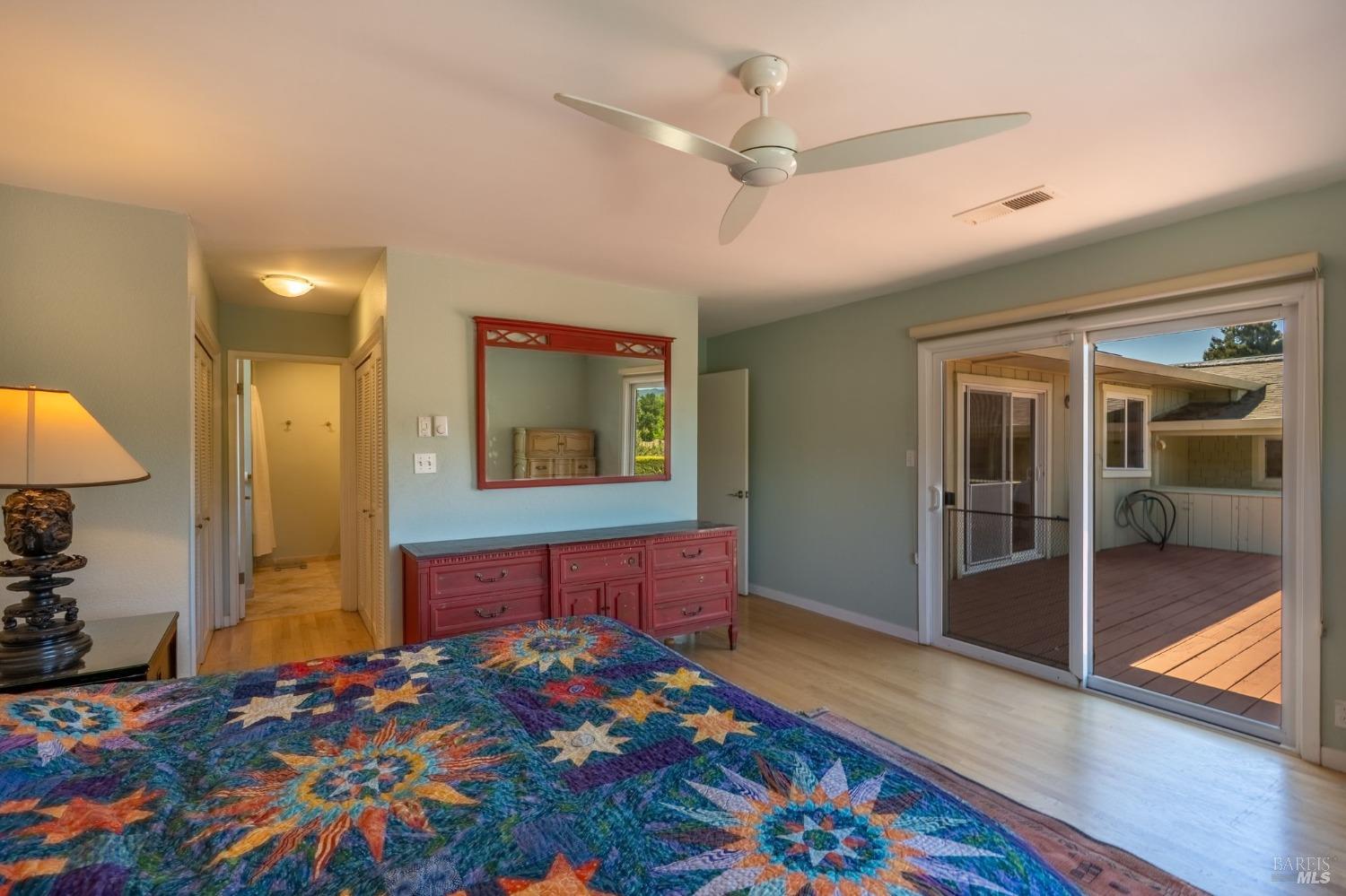 1550 Yountville Cross Road Napa, CA 94558 - Photo 35 of 45 a bedroom with a bed and a chandelier