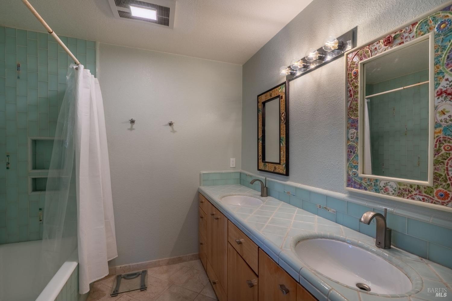 1550 Yountville Cross Road Napa, CA 94558 - Photo 36 of 45 a bathroom with a sink vanity granite and shower