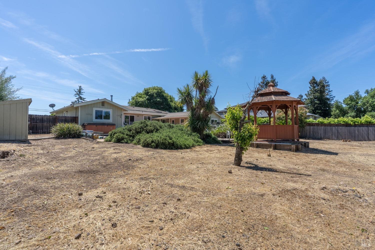 1550 Yountville Cross Road Napa, CA 94558 - Photo 44 of 45 a view of a house with a yard and sitting area