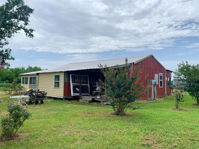 a bathroom with a sink and mirror with toilet