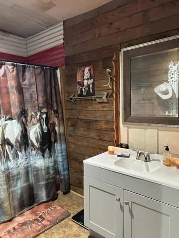 a room with furniture and flat screen tv