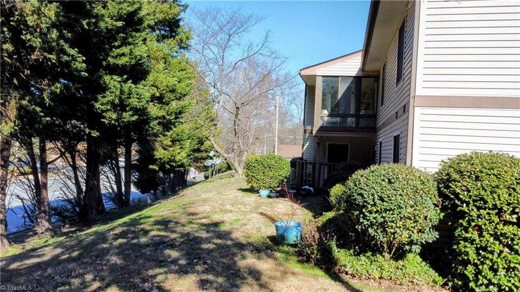 1740 North Hamilton Street, Unit F High Point, NC 27262 - Photo 21 of 24 Upper level condo with sunroom overlooking tree line