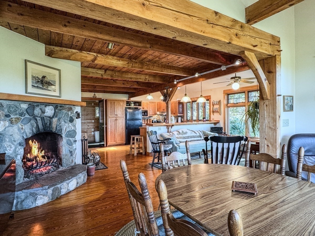 261 Old Wendell Road Northfield, MA 01360 - Photo 17 of 42 a view of a dining room with furniture window and wooden floor