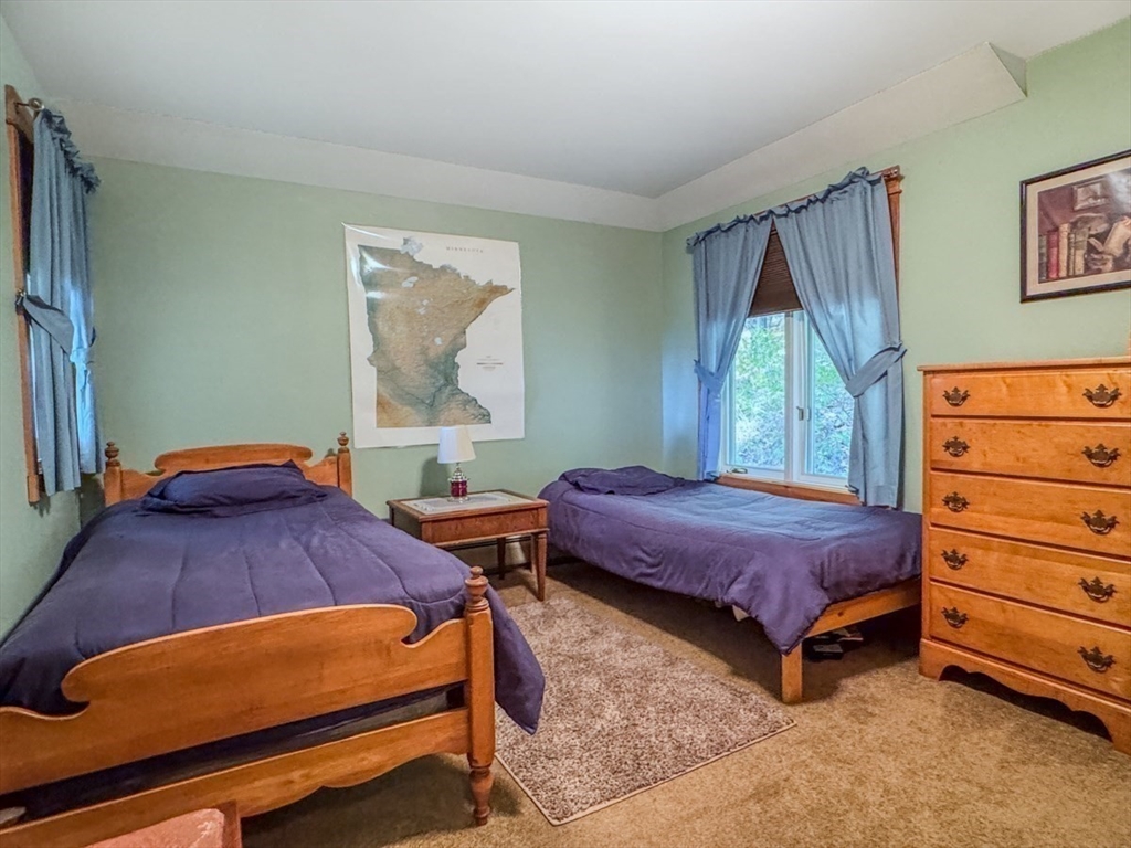 261 Old Wendell Road Northfield, MA 01360 - Photo 21 of 42 a bedroom with a bed and a dresser
