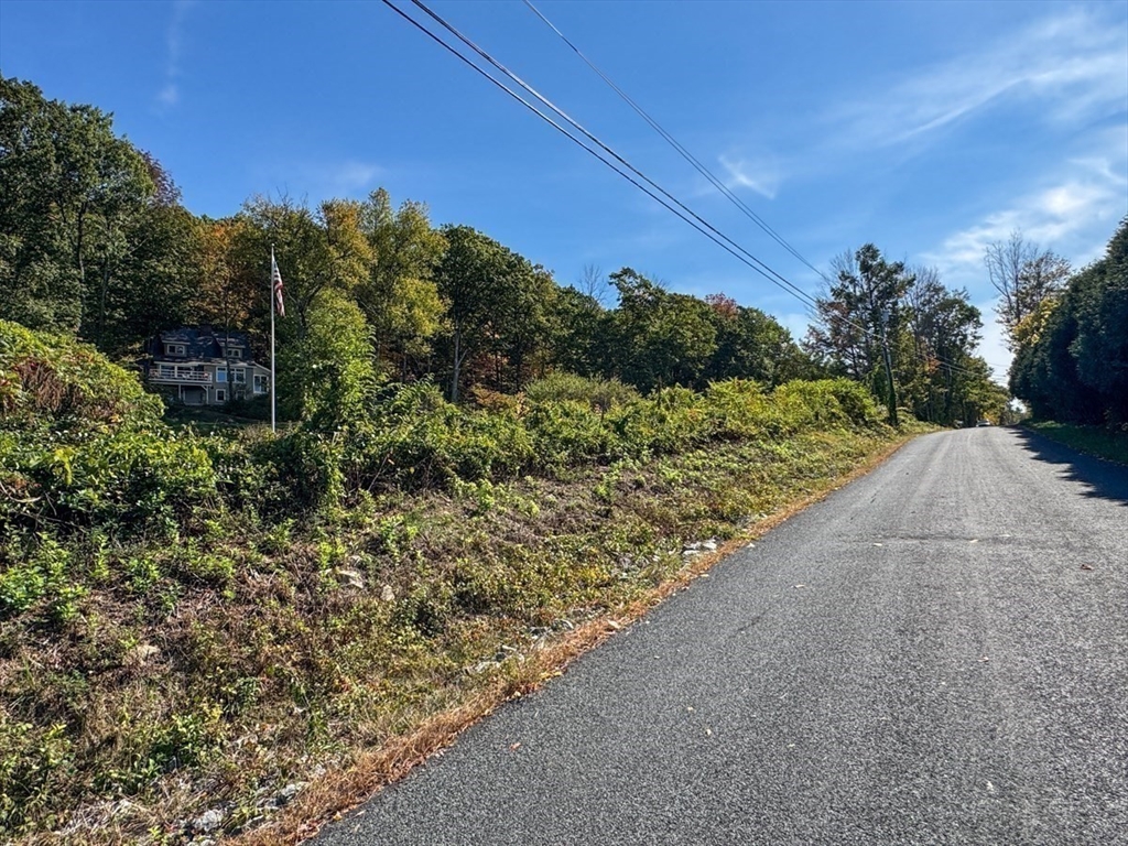 261 Old Wendell Road Northfield, MA 01360 - Photo 3 of 42 a view of a road with a yard