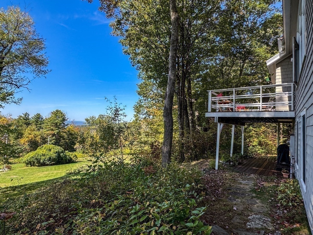 261 Old Wendell Road Northfield, MA 01360 - Photo 34 of 42 a backyard of a house with lots of green space